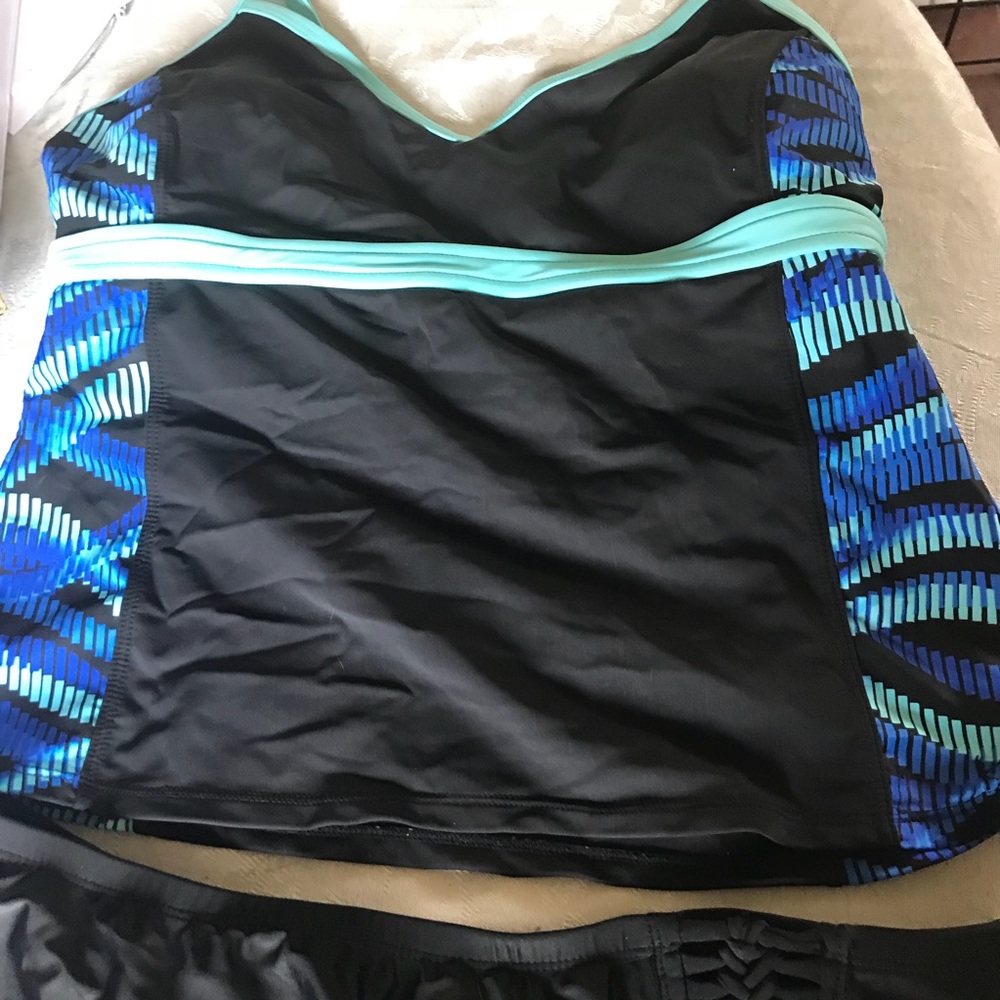 Swimsuit tankini with 2 pairs of bottoms.